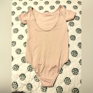 Baby pink Lululemon body suit